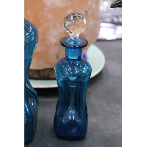 155 - TWO HOLMEGAARD KLUK-KLUK DECANTERS IN KINGFISHER BLUE WITH CLEAR STOPPERS, HEIGHTS 22CM AND 16CM