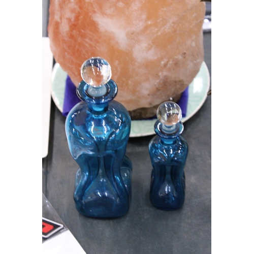 155 - TWO HOLMEGAARD KLUK-KLUK DECANTERS IN KINGFISHER BLUE WITH CLEAR STOPPERS, HEIGHTS 22CM AND 16CM