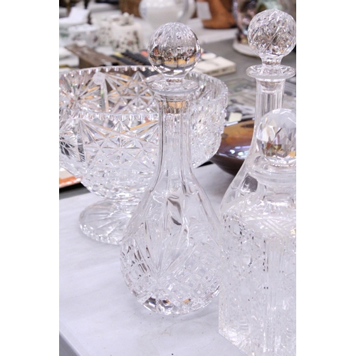 161 - THREE CUT GLASS DECANTERS TOGETHER WITH A LARGE CUT GLASS FOOTED BOWL