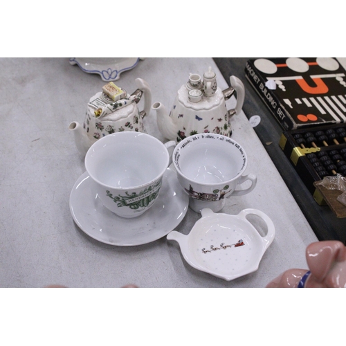 165 - TWO MINIATURE PORTMERION TEAPOTS TOGETHER WITH A HENDRICK'S GIN TEACUP AND SAUCER, CHARLES DICKENS C... 