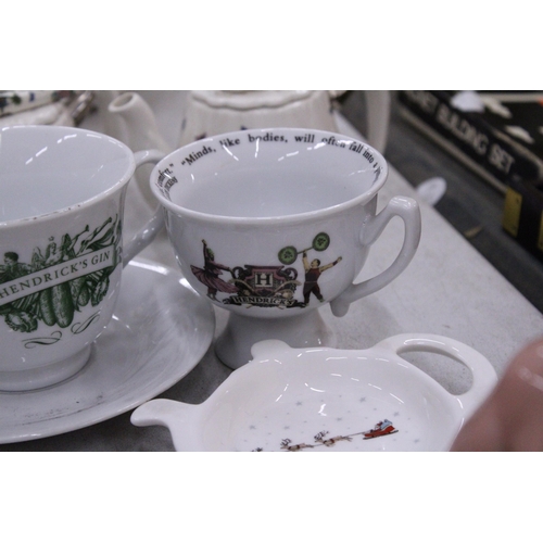 165 - TWO MINIATURE PORTMERION TEAPOTS TOGETHER WITH A HENDRICK'S GIN TEACUP AND SAUCER, CHARLES DICKENS C... 