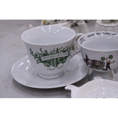 165 - TWO MINIATURE PORTMERION TEAPOTS TOGETHER WITH A HENDRICK'S GIN TEACUP AND SAUCER, CHARLES DICKENS C... 