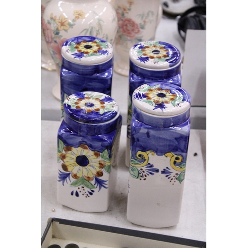 174 - FOUR CERAMIC HANDPAINTED STORAGE JARS