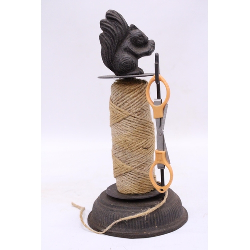 186 - A VINTAGE STYLE CAST STRING HOLDER WITH A SQUIRREL TO THE TOP, HEIGHT 25CM