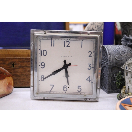 213 - TWO CLOCKS TO INCLUDE A HEAVY MARBLED STONE AND A NEWGATE ART DECO STYLE WITH BATTERY MOVEMENT