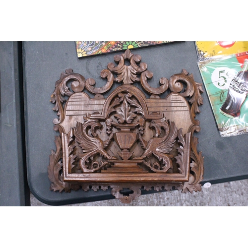 216 - A CARVED MAHOGANY WALL HANGING MAGAZINE/LETTER RACK WITH GRIFFIN DESIGN, 36CM X 40CM