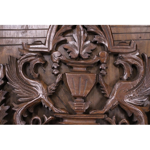 216 - A CARVED MAHOGANY WALL HANGING MAGAZINE/LETTER RACK WITH GRIFFIN DESIGN, 36CM X 40CM