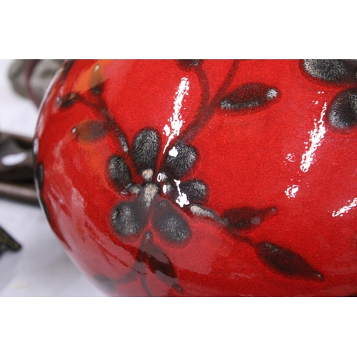 234 - A LARGE BULBOUS CERAMIC VASE, CRIMSON WITH FLORAL DECORATION, HEIGHT APPROX 26CM