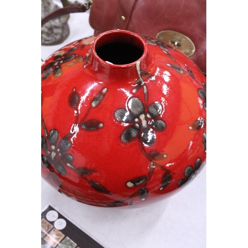 234 - A LARGE BULBOUS CERAMIC VASE, CRIMSON WITH FLORAL DECORATION, HEIGHT APPROX 26CM