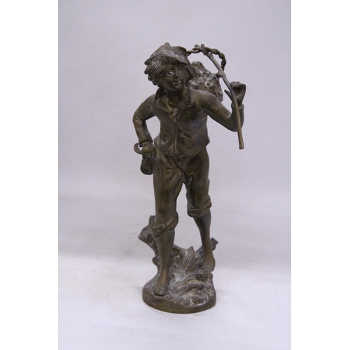 239 - A VINTAGE BRASS SCULPTURE OF A BOY WITH A BASKET, HEIGHT 35CM