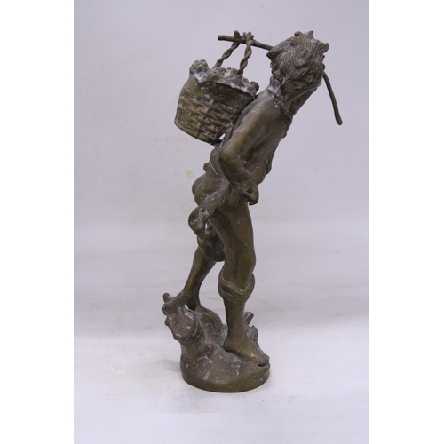 239 - A VINTAGE BRASS SCULPTURE OF A BOY WITH A BASKET, HEIGHT 35CM