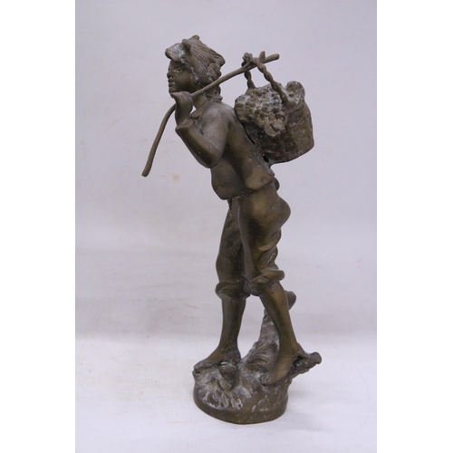 239 - A VINTAGE BRASS SCULPTURE OF A BOY WITH A BASKET, HEIGHT 35CM