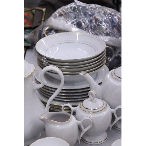 243 - A COLLECTION OF CHINA PLATES, SIDE PLATES, BOWLS, A TEA POT, COFFEE POT, CREAM JUG, SUGAR BOWL, CUPS... 