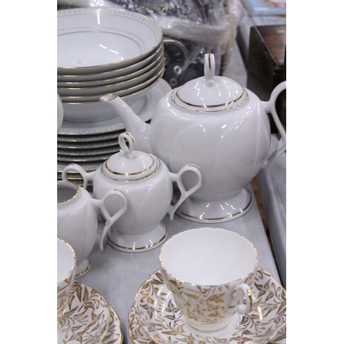 243 - A COLLECTION OF CHINA PLATES, SIDE PLATES, BOWLS, A TEA POT, COFFEE POT, CREAM JUG, SUGAR BOWL, CUPS... 