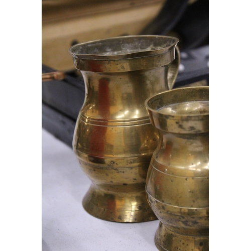 64 - A BRASS SET OF FIVE MEASURING TANKARDS