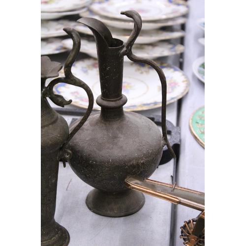 68 - A PAIR OF INDIAN BRASS ENGRAVED EWERS WITH COBRA HANDLES TOGETHER WITH A BRASS ENGRAVED URN VASE WIT... 