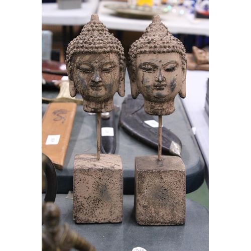 98 - A PAIR OF BUDDHA HEADS ON STANDS