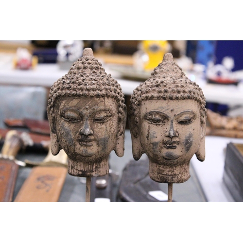 98 - A PAIR OF BUDDHA HEADS ON STANDS