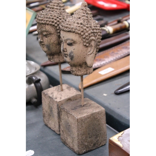 98 - A PAIR OF BUDDHA HEADS ON STANDS