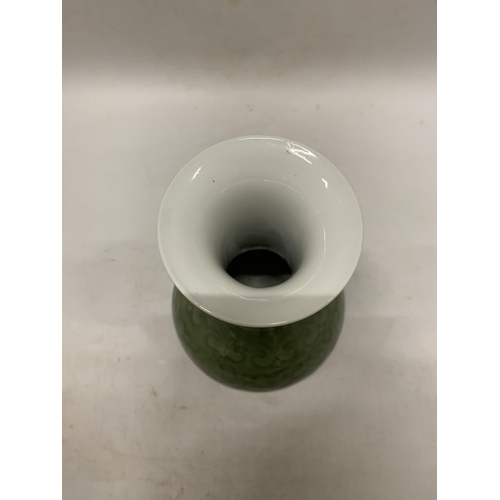 357 - A CHINESE CELADON GREEN GLAZED PORCELAIN BALUSTER VASE - 23 CM