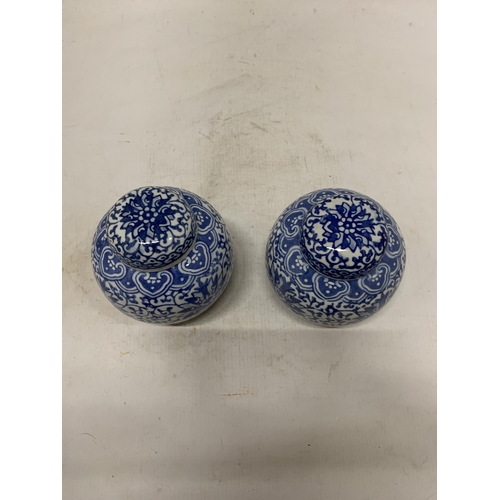 358 - A PAIR OF CHINESE BLUE AND WHTE FLORAL PORCELAIN LIDDED GINGER JARS