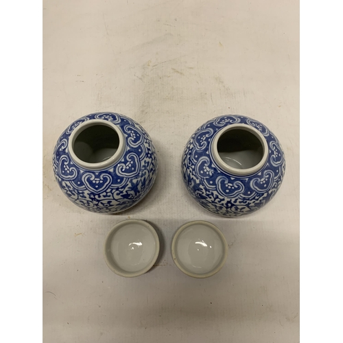 358 - A PAIR OF CHINESE BLUE AND WHTE FLORAL PORCELAIN LIDDED GINGER JARS