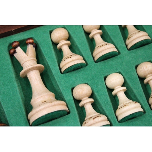 300 - A WOODEN CHESSBOARD AND A FULL SET OF CHESS PIECES