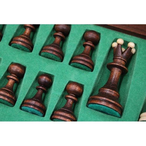 300 - A WOODEN CHESSBOARD AND A FULL SET OF CHESS PIECES