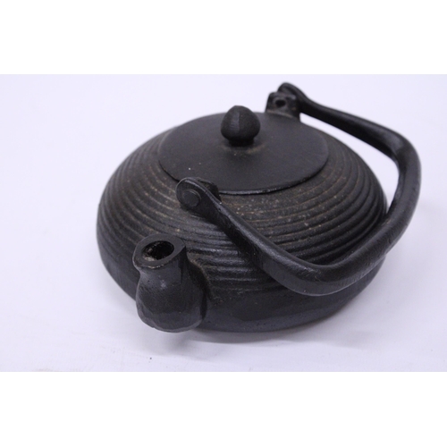 369 - A CAST IRON JAPANESE TEAPOT