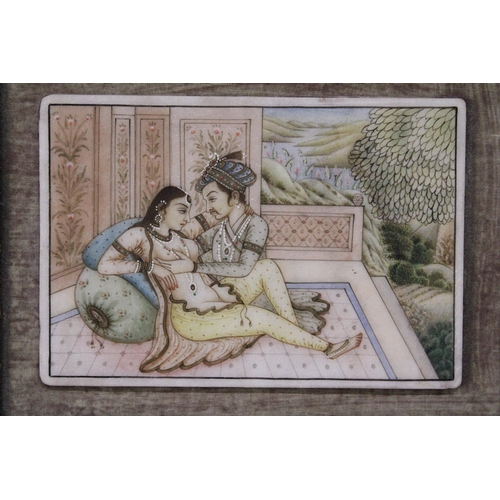 370 - AN INDIAN MINIATURE PAINTING IN A FRAMED BOOK