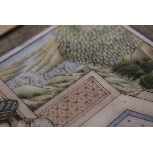 370 - AN INDIAN MINIATURE PAINTING IN A FRAMED BOOK