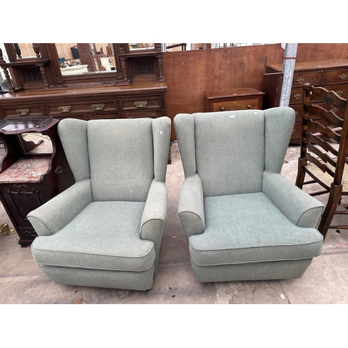 3112 - A PAIR OF WINGED EASY CHAIRS