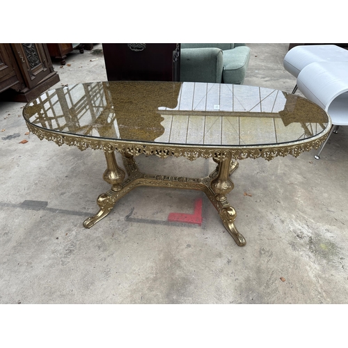 3114 - AN OVAL COFFEE TABLE ON BRASS PEDESTAL BASE