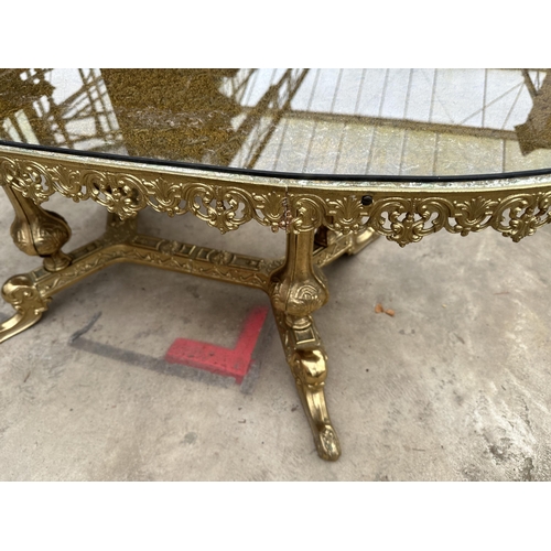 3114 - AN OVAL COFFEE TABLE ON BRASS PEDESTAL BASE