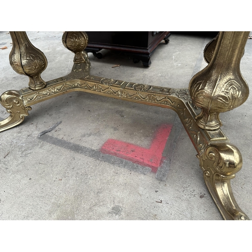 3114 - AN OVAL COFFEE TABLE ON BRASS PEDESTAL BASE