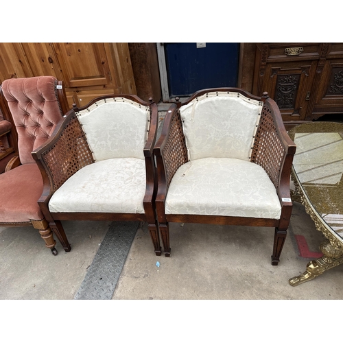 3115 - A PAIR OF BERGERE TUB CHAIRS ON TAPERING FRONT LEGS