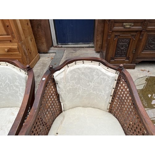 3115 - A PAIR OF BERGERE TUB CHAIRS ON TAPERING FRONT LEGS