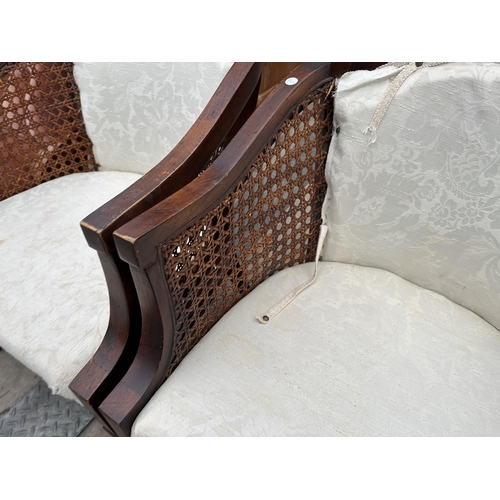 3115 - A PAIR OF BERGERE TUB CHAIRS ON TAPERING FRONT LEGS