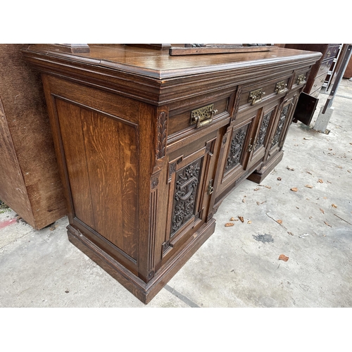 3117 - A VICTORIAN OAK MIRROR BACK SIDEBOARD WITH THREE FRIEZE DRAWERS AND FOUR CARVED PANEL DOORS TO BASE ... 