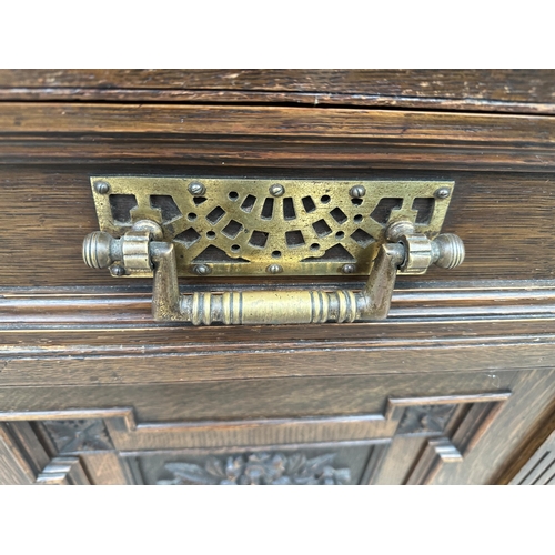 3117 - A VICTORIAN OAK MIRROR BACK SIDEBOARD WITH THREE FRIEZE DRAWERS AND FOUR CARVED PANEL DOORS TO BASE ... 