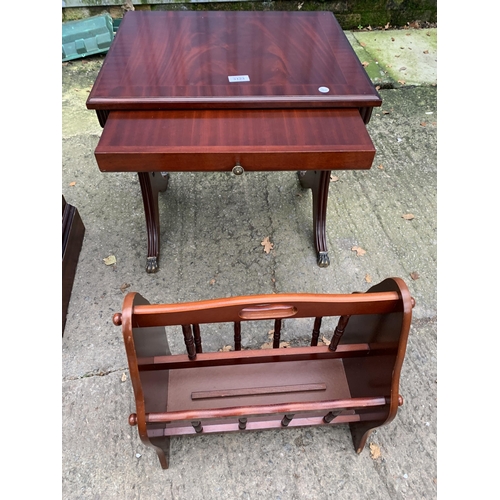 3123 - A MAHOGANY AND CROSS BANDED LAMP TABLE ENCLOSING DRAWER AND MAGAZINE RACK