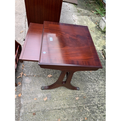 3123 - A MAHOGANY AND CROSS BANDED LAMP TABLE ENCLOSING DRAWER AND MAGAZINE RACK