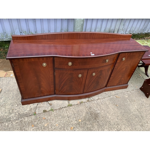 3124 - A MAHOGANY AND CROSSBANDED BOW FRONTED STAG SIDEBOARD ENCLOSING FOUR CUPBOARDS AND ONE DRAWER 68