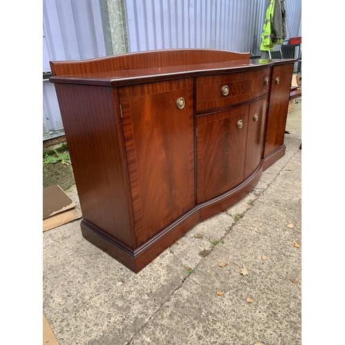 3124 - A MAHOGANY AND CROSSBANDED BOW FRONTED STAG SIDEBOARD ENCLOSING FOUR CUPBOARDS AND ONE DRAWER 68