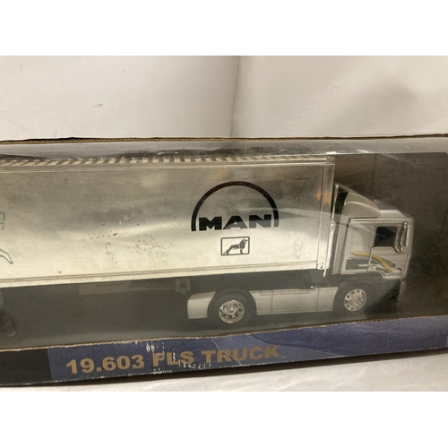 396 - A BOXED NEW-RAY LONG HAULER COLLECTION MAN 19.603 FLS TRUCK, 1/32 SCALE, PLUS AN UNBOXED ONE