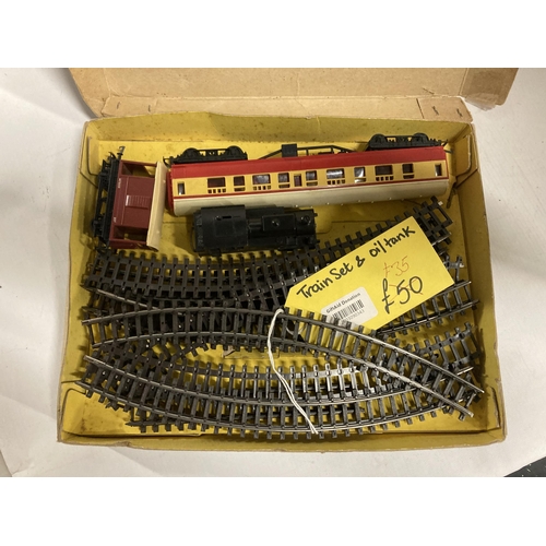 411 - A BOXED TRI-ANG RAILWAYS SET TO INCLUDE A LOCOMOTIVE COACH ROLLING STOCK AND TRAIN TRACK.