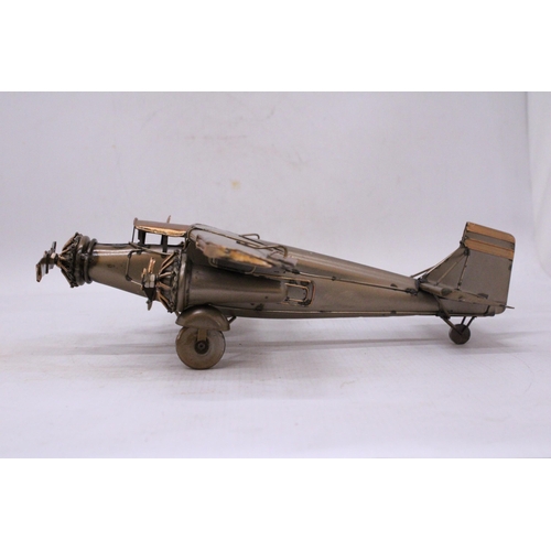 62 - A TIN PLATE THREE ENGINE AEROPLANE