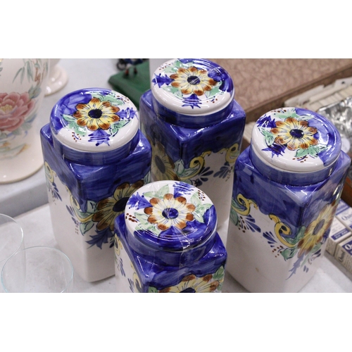 174 - FOUR CERAMIC HANDPAINTED STORAGE JARS