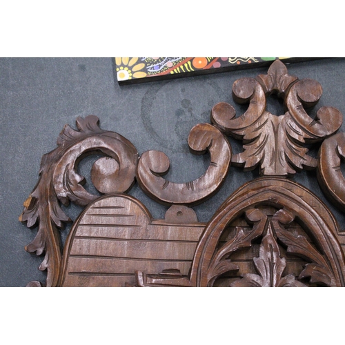 216 - A CARVED MAHOGANY WALL HANGING MAGAZINE/LETTER RACK WITH GRIFFIN DESIGN, 36CM X 40CM