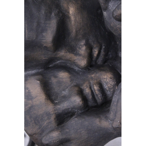 231 - A RESIN SCULPTURE OF A COUPLE, HEIGHT 30CM